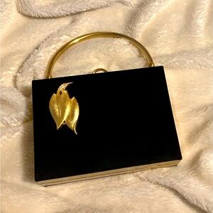 Rare vintage Evans handbag in black satin/gold metal. Includes jewelry pouch.